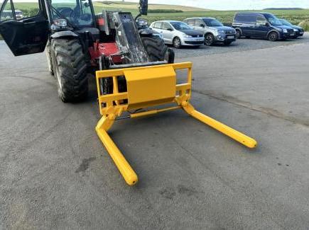 Wrapped bale handler with Kramer 580T hooks